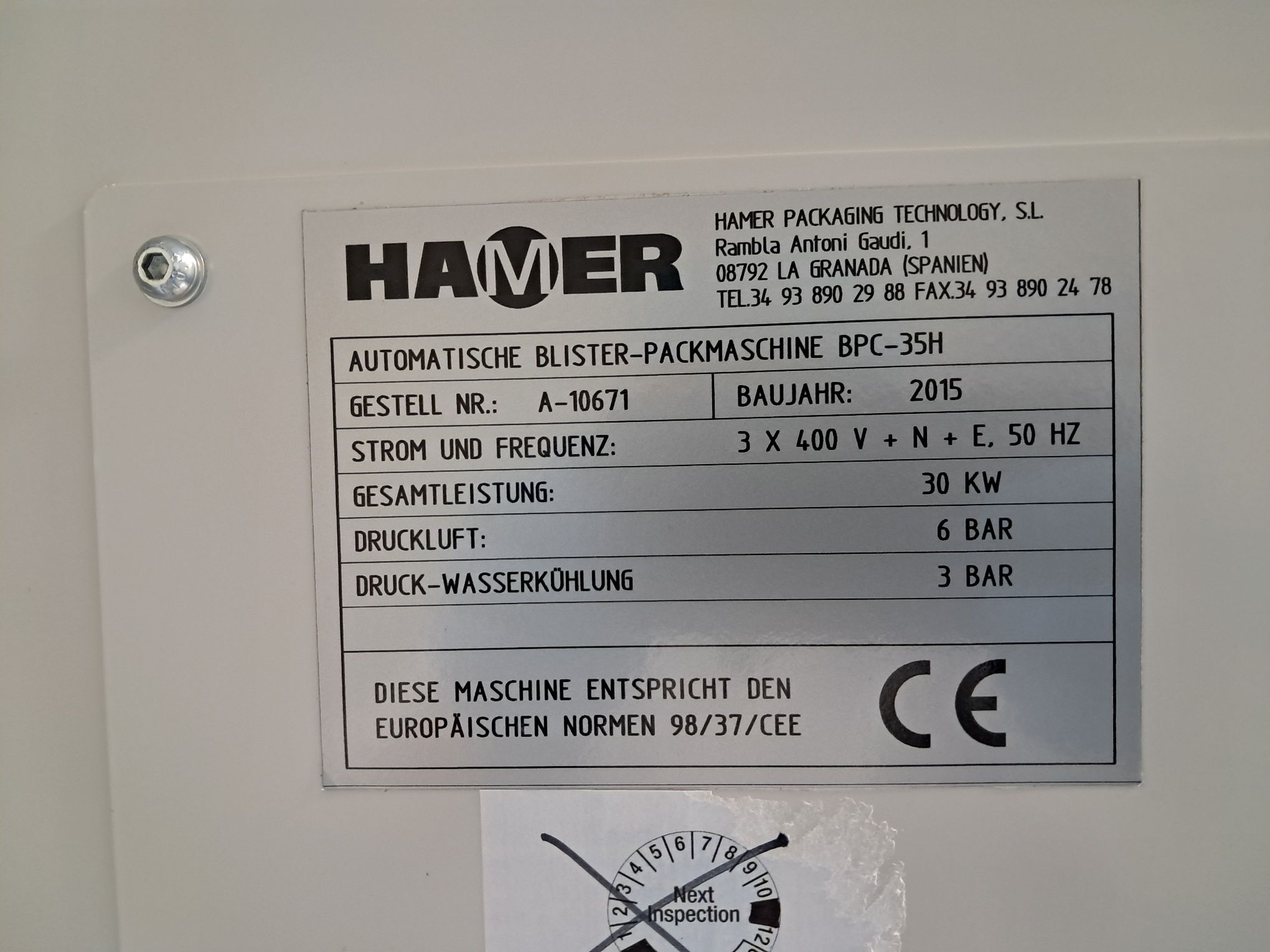 Zdjęcie przedstawia tabliczkę znamionową maszyny pakującej Hammer
