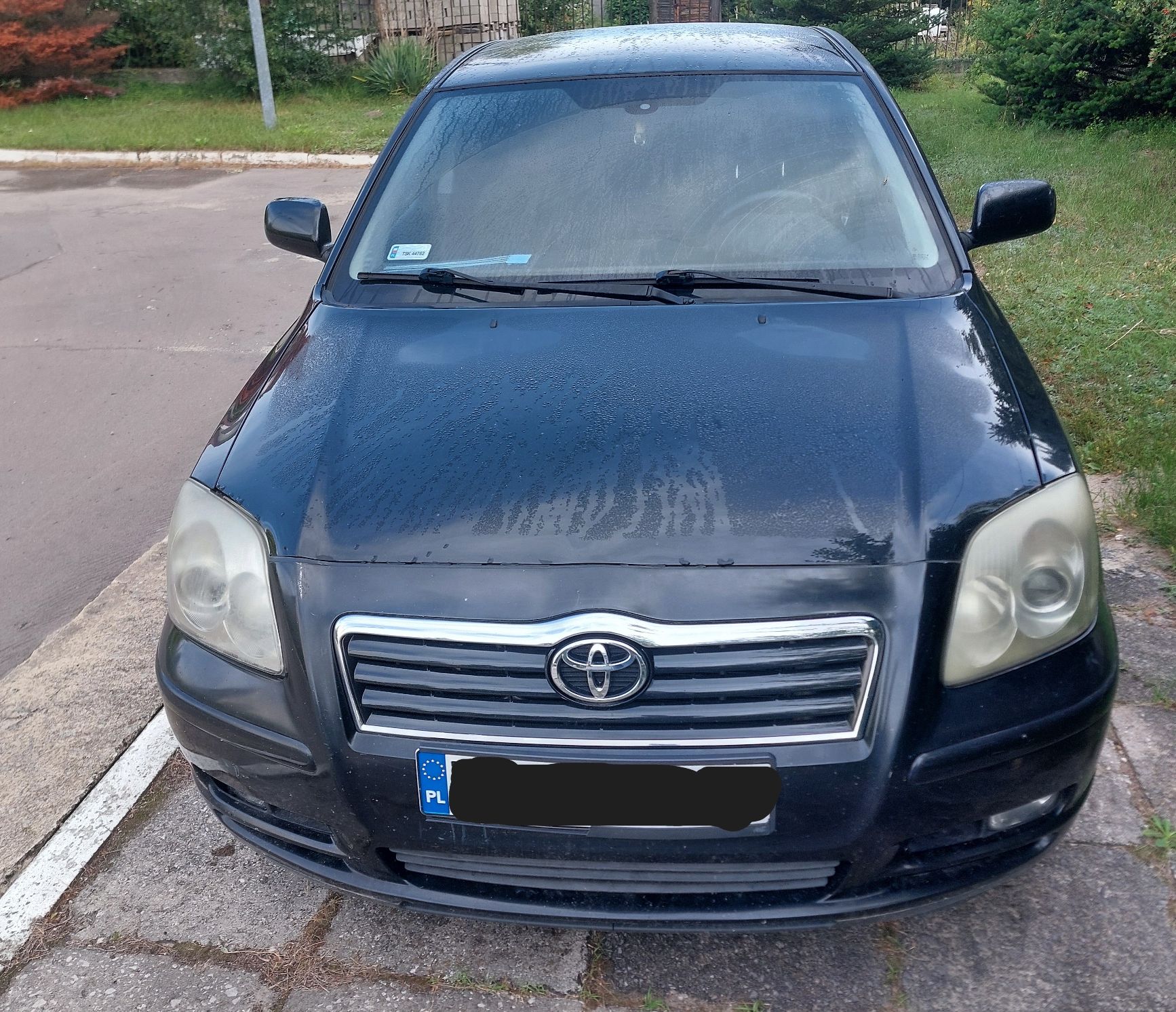 Samochód osobowy Toyota Avensis, przód pojazdu, kolor czarny